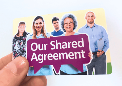 Our Shared Agreement Z Card in hand